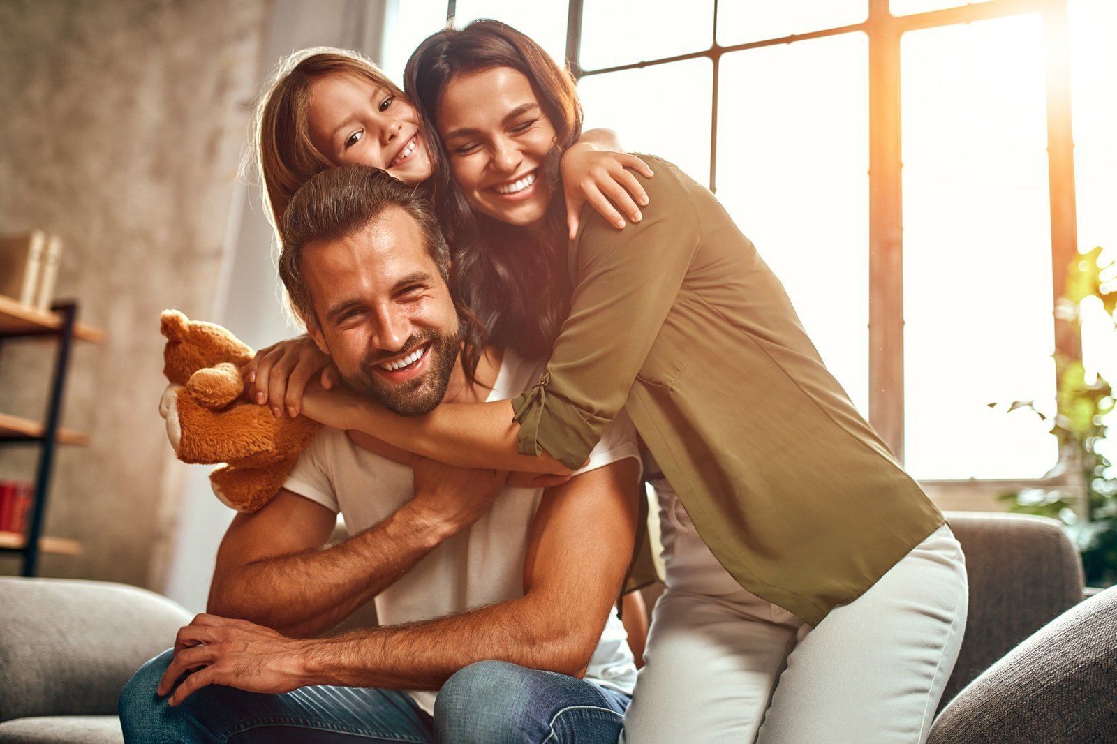 Family relaxing comfortably together at home, warm and content